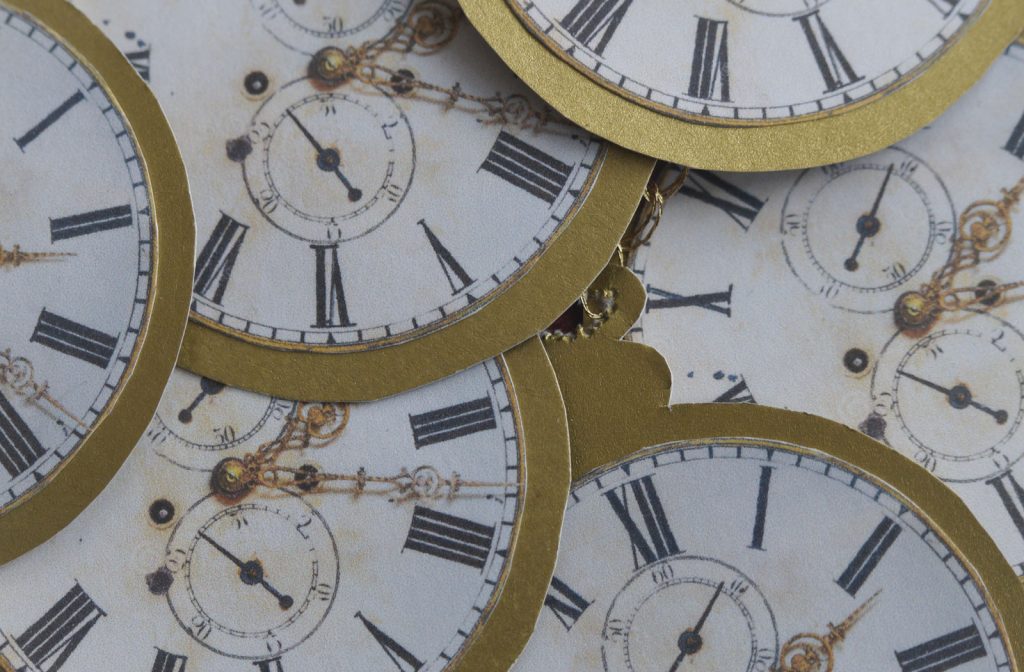 Close up image of cardboard clock faces